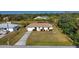 Aerial view of a single story house with a yard at 7148 Totem Ave, North Port, FL 34291