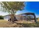 Expansive backyard featuring a screened pool and patio area at 7148 Totem Ave, North Port, FL 34291