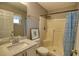 Clean bathroom with shower, toilet and granite countertop vanity at 7148 Totem Ave, North Port, FL 34291