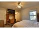Comfortable bedroom with a TV and direct access to the backyard at 7148 Totem Ave, North Port, FL 34291
