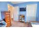 Bright bedroom with double bed, TV, and ample closet space at 7148 Totem Ave, North Port, FL 34291