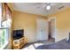 Bedroom with a view, TV, and access to a nearby bathroom at 7148 Totem Ave, North Port, FL 34291