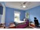 Bedroom with blue walls, a twin bed, and a ceiling fan at 7148 Totem Ave, North Port, FL 34291