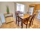 Dining area with a wooden table and chairs near the kitchen at 7148 Totem Ave, North Port, FL 34291