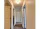 Hallway with carpet, access to bedrooms and bathrooms at 7148 Totem Ave, North Port, FL 34291