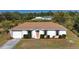 Single-story house with a brown roof and landscaped yard at 7148 Totem Ave, North Port, FL 34291