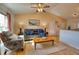 Living room with gray couch, coffee table, and hardwood floors at 7148 Totem Ave, North Port, FL 34291