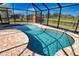 Inviting kidney-shaped pool with ample surrounding patio space at 7148 Totem Ave, North Port, FL 34291