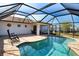 Spacious pool and patio area with plenty of room for lounging at 7148 Totem Ave, North Port, FL 34291