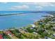 Aerial view of waterfront home with private dock and access to the bay at 716 Sarabay Rd, Osprey, FL 34229