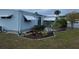 Landscaped side yard of the mobile home at 784 Londra Dr, Venice, FL 34285