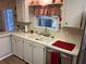 Clean white cabinets and a double sink in this kitchen at 784 Londra Dr, Venice, FL 34285