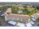 Community aerial view showcasing building and parking at 832 Bird Bay Way # 113, Venice, FL 34285