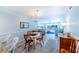 Bright dining room with a view of the living room at 832 Bird Bay Way # 113, Venice, FL 34285