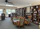 Community library with comfortable seating and books at 832 Bird Bay Way # 113, Venice, FL 34285