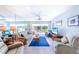 Bright living room with sliding glass doors leading to a balcony at 832 Bird Bay Way # 113, Venice, FL 34285