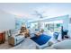 Spacious living area featuring a blue rug and ample seating at 832 Bird Bay Way # 113, Venice, FL 34285