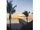 Scenic sunset over pier and ocean at 832 Bird Bay Way # 113, Venice, FL 34285