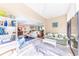 Bright sunroom with comfortable seating and view of living room at 832 Bird Bay Way # 113, Venice, FL 34285