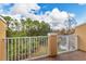 Private balcony overlooking wooded area and a pond at 8649 Majestic Elm Ct, Lakewood Ranch, FL 34202