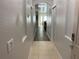 Bright hallway with tile floors and archway leading into the living area at 9019 Stone Harbour Loop, Bradenton, FL 34212