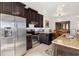 Modern kitchen with stainless steel appliances and granite countertops at 9019 Stone Harbour Loop, Bradenton, FL 34212