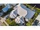 Aerial view of the house with a screened pool area at 1009 Harbor Town Dr, Venice, FL 34292