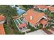 Aerial view of community showing home with shuffleboard courts at 1009 Harbor Town Dr, Venice, FL 34292