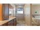 Bathroom with walk-in shower and granite vanity at 1009 Harbor Town Dr, Venice, FL 34292