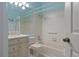 Bathroom with bathtub, shower, and vanity at 1009 Harbor Town Dr, Venice, FL 34292