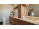Double vanity bathroom with granite countertop and shower at 1009 Harbor Town Dr, Venice, FL 34292