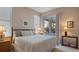Spacious bedroom with sliding door to patio at 1009 Harbor Town Dr, Venice, FL 34292