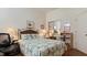 Bedroom with mirrored closet doors and bookcase at 1009 Harbor Town Dr, Venice, FL 34292