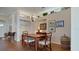 Bright dining room with hardwood floors and built-in shelving at 1009 Harbor Town Dr, Venice, FL 34292