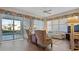 Living area with sliding doors leading to the pool at 1009 Harbor Town Dr, Venice, FL 34292