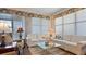 Spacious living room with ample natural light and comfy sofas at 1009 Harbor Town Dr, Venice, FL 34292