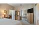Main bedroom with mirrored closet and ensuite bathroom at 1009 Harbor Town Dr, Venice, FL 34292