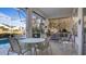 Relaxing screened patio with pool view and seating area at 1009 Harbor Town Dr, Venice, FL 34292
