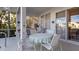 Spacious screened patio with outdoor furniture and pool access at 1009 Harbor Town Dr, Venice, FL 34292