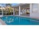 Sparkling pool with screened enclosure and patio area at 1009 Harbor Town Dr, Venice, FL 34292