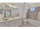 Clean bathroom with a bathtub, toilet and vanity at 10217 Staggerbush Dr # 202, Venice, FL 34293