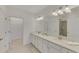 Double vanity bathroom with a walk-in shower at 10217 Staggerbush Dr # 202, Venice, FL 34293