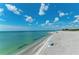 Expansive beach with clear water and a partially cloudy sky at 10217 Staggerbush Dr # 202, Venice, FL 34293