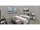 Spacious bedroom with large windows and plush bedding at 10217 Staggerbush Dr # 202, Venice, FL 34293