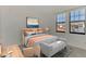 Bright bedroom with large windows and comfortable sitting area at 10217 Staggerbush Dr # 202, Venice, FL 34293