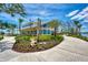 Community clubhouse with welcoming landscaping and outdoor seating at 10217 Staggerbush Dr # 202, Venice, FL 34293