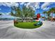 Relaxing area with a large tree and seating at 10217 Staggerbush Dr # 202, Venice, FL 34293