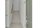 Staircase to second floor; neutral color palette at 10217 Staggerbush Dr # 202, Venice, FL 34293