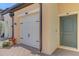 Townhome entry; two-car garage and front door at 10217 Staggerbush Dr # 202, Venice, FL 34293
