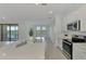 Modern kitchen with stainless steel appliances and island at 10217 Staggerbush Dr # 202, Venice, FL 34293